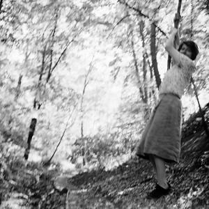 Vivian Maier swinging on a vine